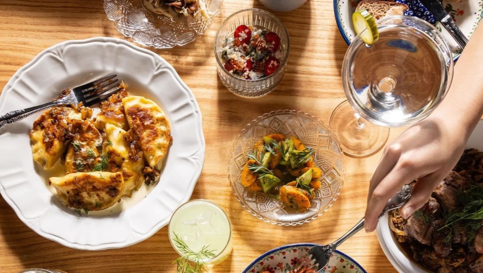 A table filled with Polish dishes and drinks.