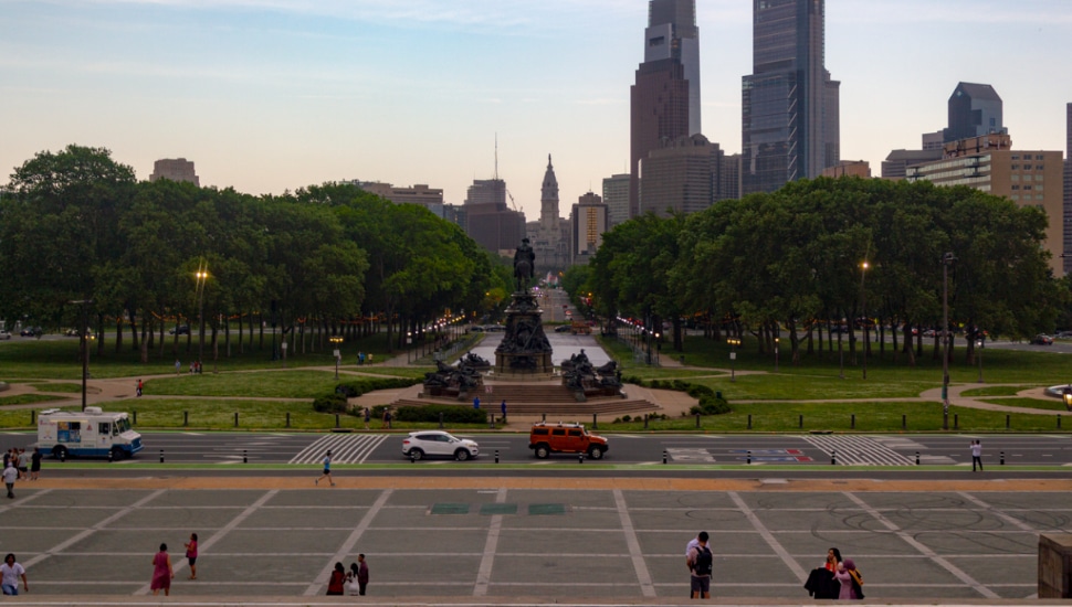 Philadelphia walking and standing outside the Philadelphia Museum of Art.