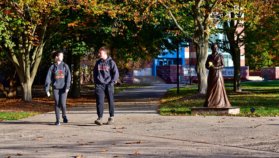 two kids walking on campus