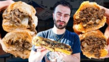 Restaurant Editor Elazar Sontag surrounded by cheesesteaks.