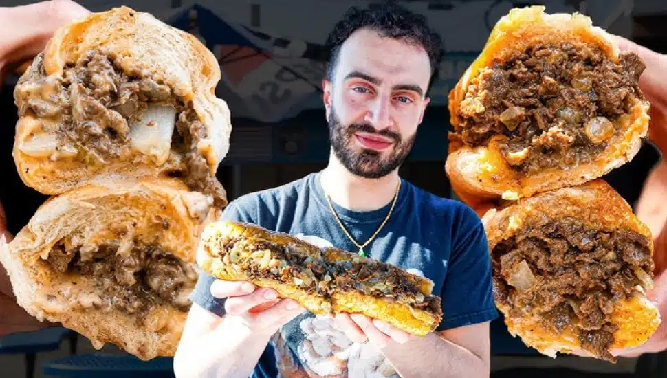 Restaurant Editor Elazar Sontag surrounded by cheesesteaks.