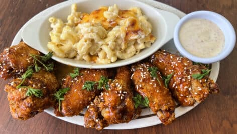 Spicy honey wings with a side of mac and cheese from Doro Bet.