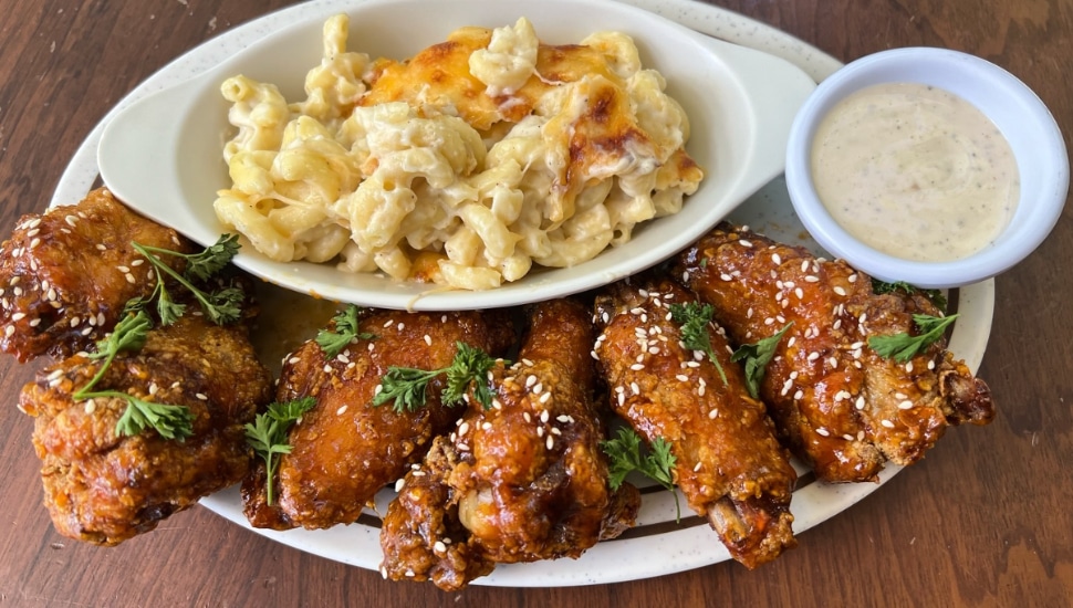 Spicy honey wings with a side of mac and cheese from Doro Bet.