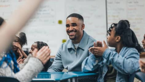 Jalen Hurts with school students.