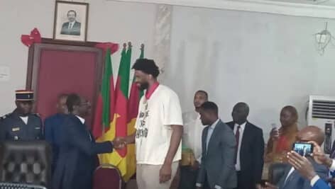 Joel Embiid shaking hands with Cameroon President Paul Biya.