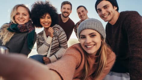 Young people taking a selfie together.