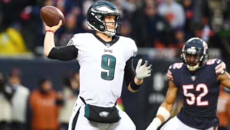 Nick Foles tossing a football.