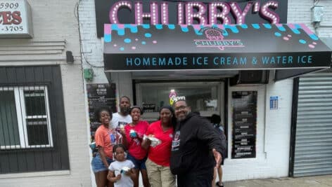 Family enjoying ice cream outside Chubby's Fantastic Flavors ice cream shop in Southwest Philadelphia.