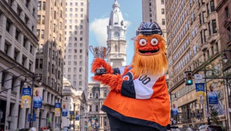 Gritty holding his NHL Mascot of the Year award trophy.