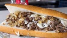 A Joe's Steaks cheesesteak on a roll