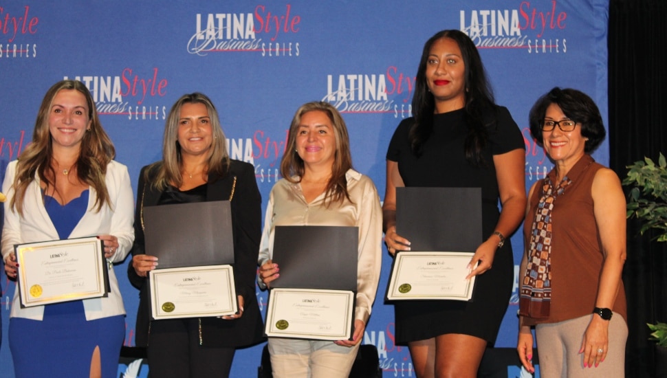 Group of Philadelphia's Latina business owners holding certificates.