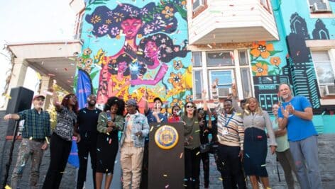 A celebration of the city's first permanent voting themed mural.