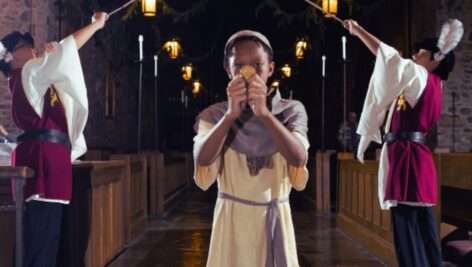 student bowing in church