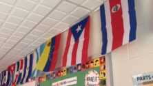 International flags line the wall of a Norristown classroom.