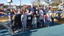 Enthusiastic kids are ready to play as a ribbon is cut opening an improved playground at the Fox Chase Recreation Center.