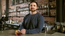 Jared Adkins behind the bar at Char and Stave in Ardmore.