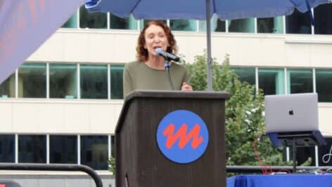 Jane Golden speaking at a podium.