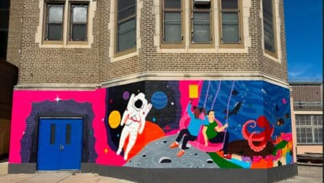 Joseph Pennell School in with mural painted on it.