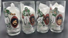 Four Philadelphia Eagles NFL glasses from McDonald's posted for sale on eBay.