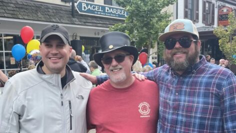 Patrick Murphy, center, with the new owners of the Bagel Barrel, Steve Cassidy, right, and Nick Muzyczka.