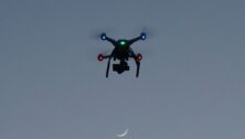 A drone flying in the night sky.