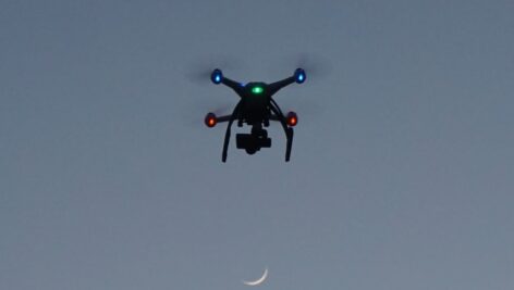 A drone flying in the night sky.