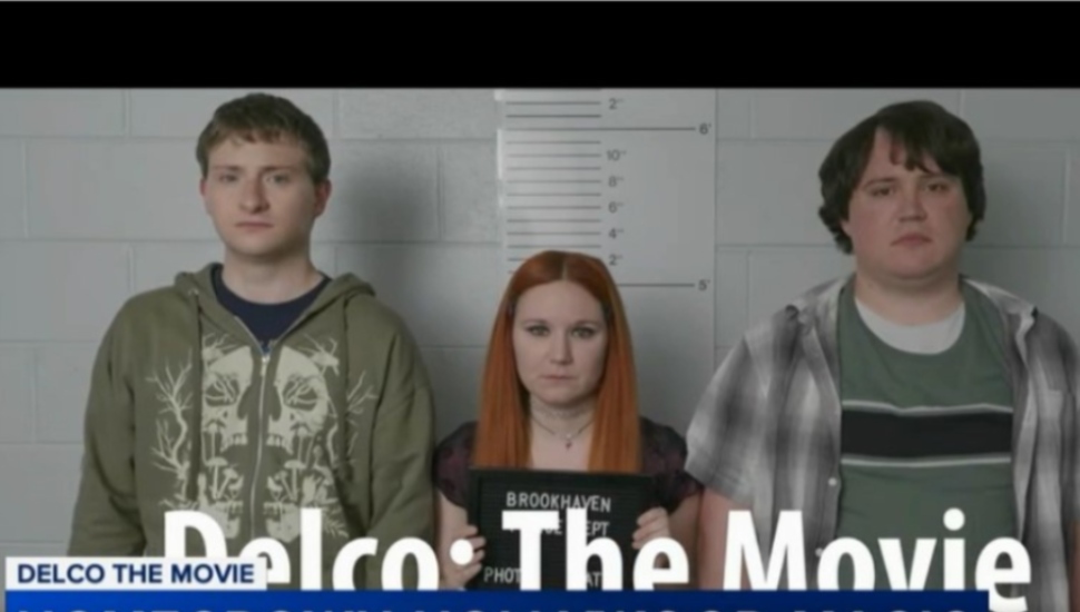 A scene from Delco: The Movie featuring three of its stars appearing in a police lineup.
