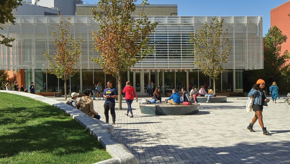 Outside of Drexel's Korman Center, with students nearby.