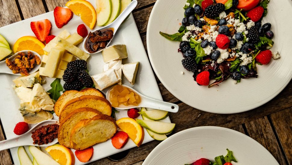Plates of salads and other food.