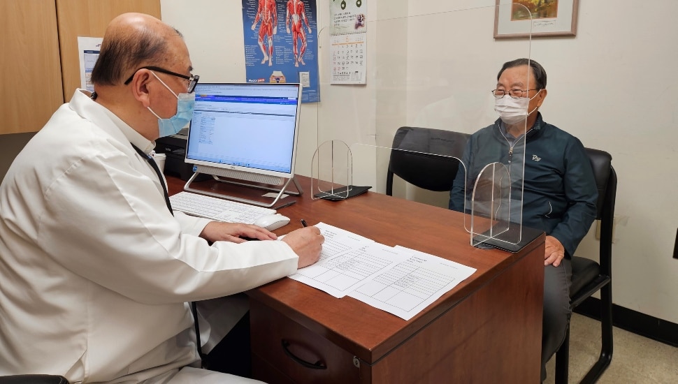 Doctor discusses treatment options with a patient.