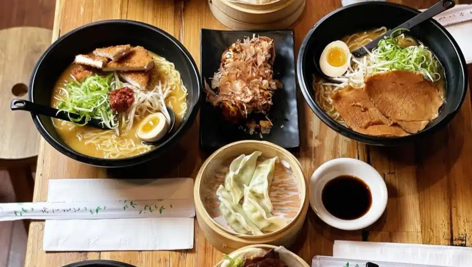 A table filled with dishes from At Ramen MNYK.