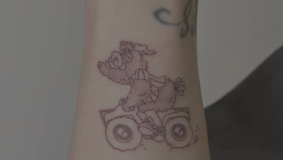 Bryce Harper's new forearm tattoo, featuring the Phillie Phanatic riding an ATV.