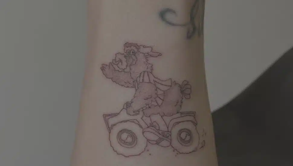 Bryce Harper's new forearm tattoo, featuring the Phillie Phanatic riding an ATV.