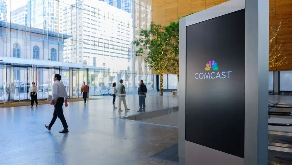 People walking in Comcast's headquarters.