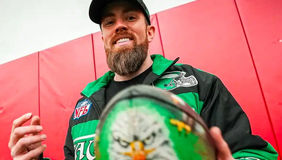 Jordan Spector holding custom, Eagles-inspired football.
