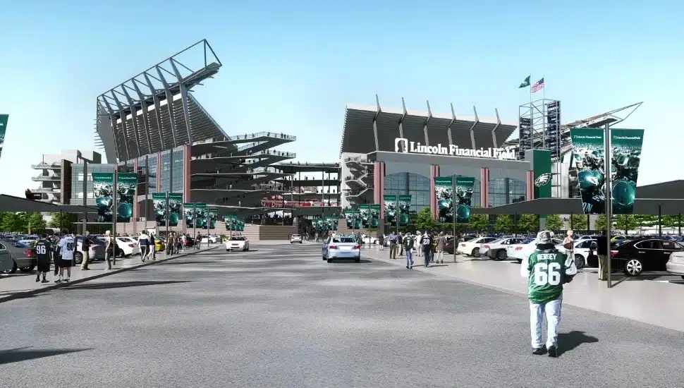 A wideshot of Lincoln Financial Field with people walking towards it.