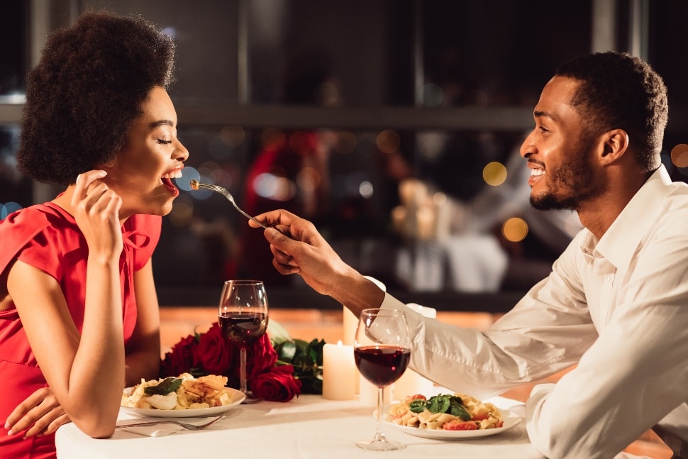 Man Feeding Girlfriend During Dinner