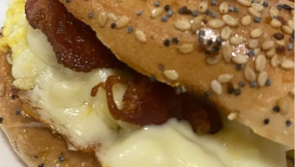 Part of a breakfast sandwich from Mina's Cafe in Ridley.