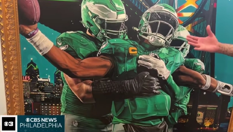 New artpiece depicting three faceless Eagles players embracing each other.