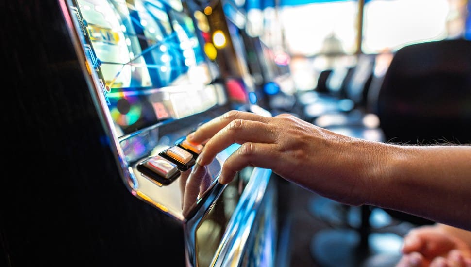 A man playing a skill machine.
