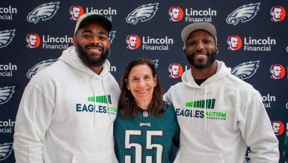 Lincoln Financial CEO Ellen Cooper with Eagles defensive end Brandon Graham (left) and former wide receiver Jason Avant.