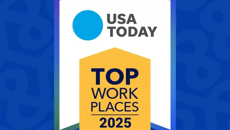 An award badge from USA TODAY displaying 'TOP WORK PLACES 2025 USA' in bold letters. The background is blue with a subtle pattern, and the badge has a white, yellow, and navy blue color scheme.