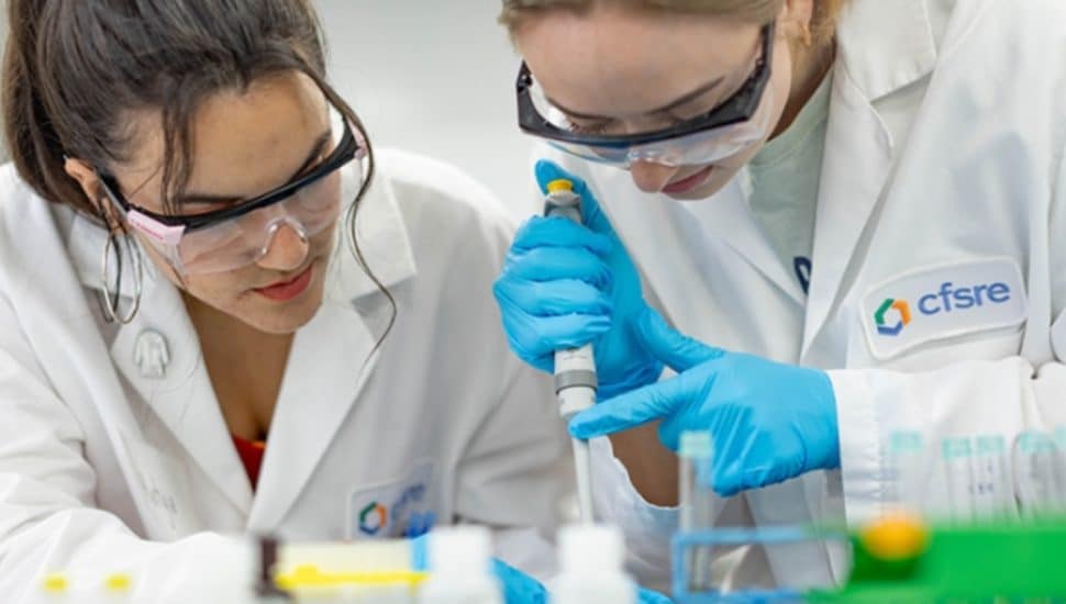 Two lab techs in a lab.