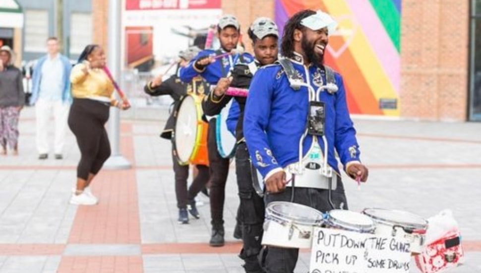 Drumming with the Positive Movement Drumline.