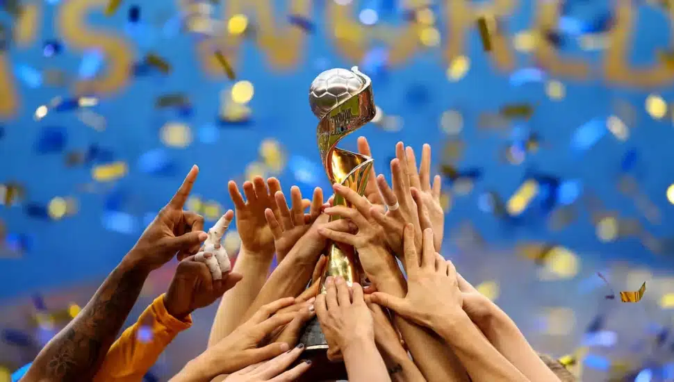 Hands on the FIFA World Cup trophy.
