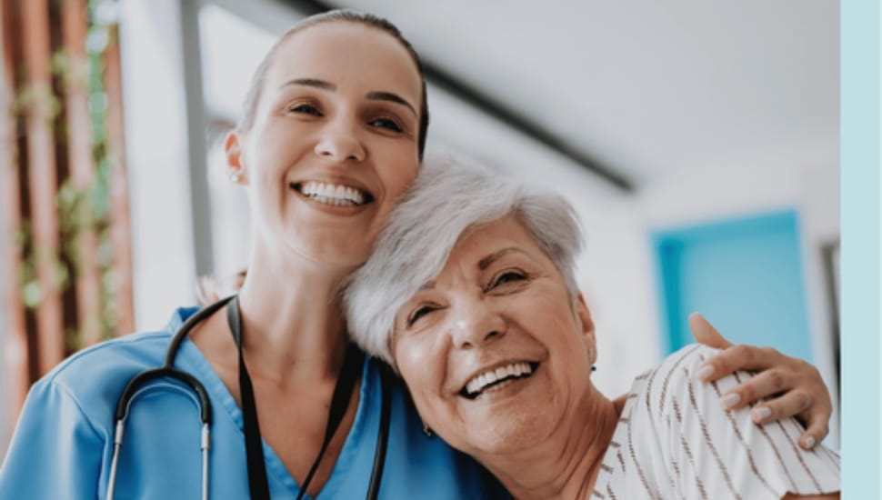 A female home care nurse with an older female patient.