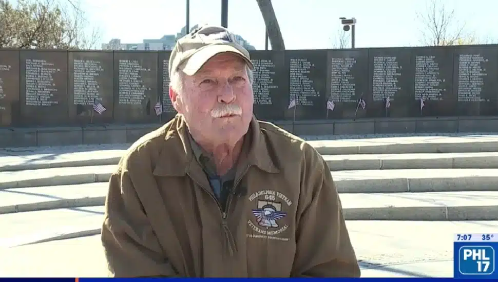 Dennis Best speaking while at the Vietnam War Veterans Memorial.