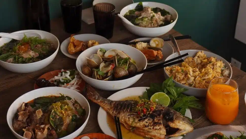 A table filled with food, including food, rice, egg dishes, and more.