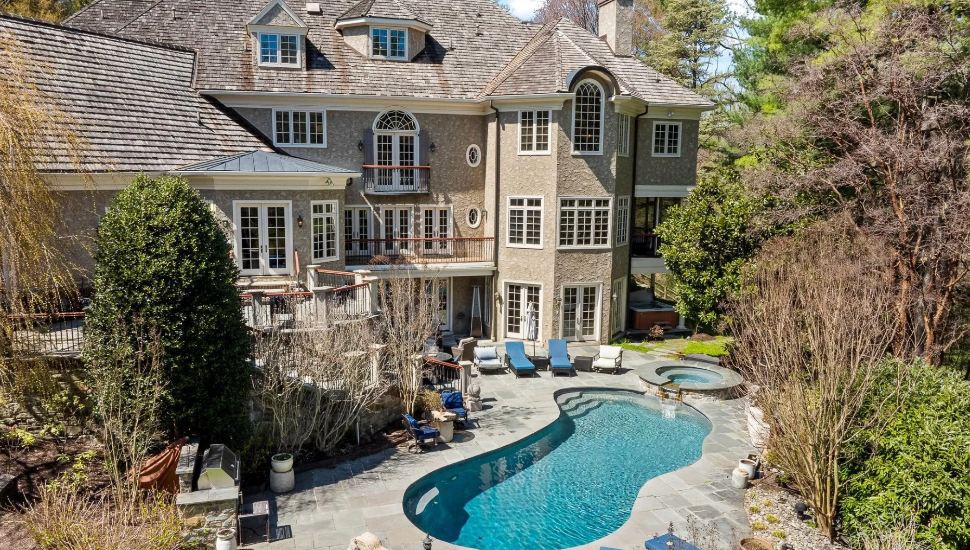 Waverly Road Gladwyne Mansion's rear view with pool.