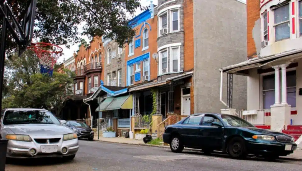 Houses in Nicetown with cars parked in front.